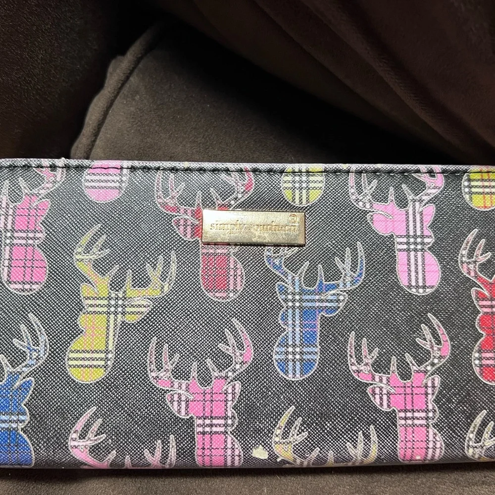 Simply southern wallet. Lots of slots for card and zips shut. Has some wear